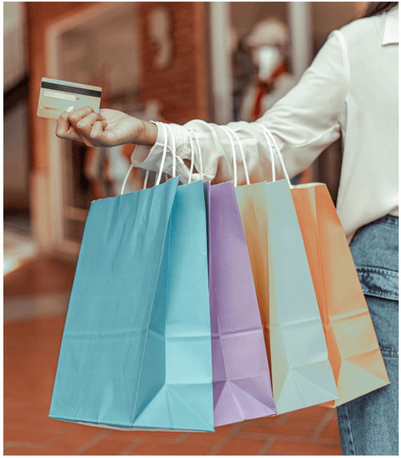 lady with shopping bags and credit card