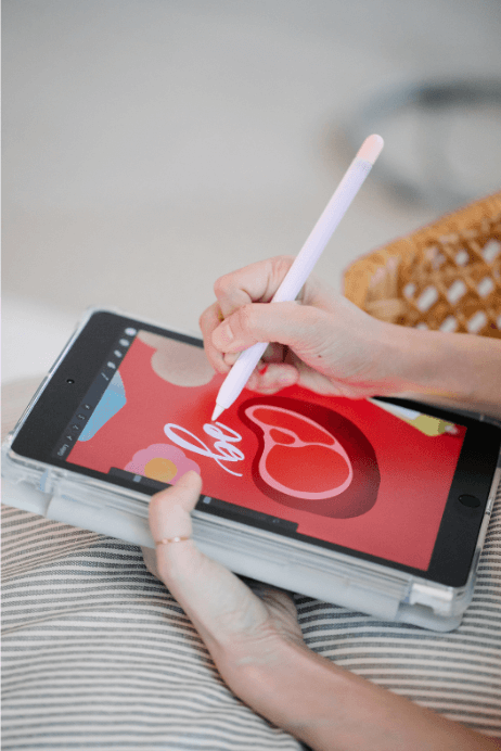 person drawing on tablet